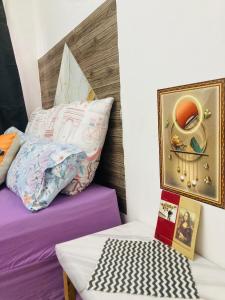 a bedroom with a bed and a picture on the wall at Home Choice in Maun
