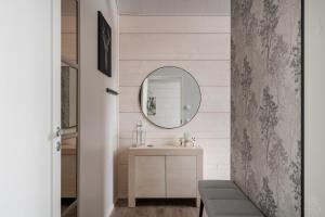 a bathroom with a sink and a mirror at Villa Lucky Live by Hilla Villas in Levi