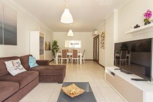 a living room with a couch and a table at B03 - Luxury 2 Bed near Lagos Marina in Lagos