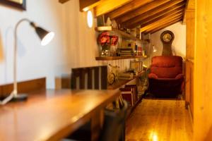 a room with a desk and a chair and a lamp at Villa vacacional el Ñeru in Cuerres