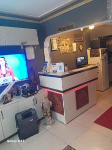 a store with a counter with a tv in a room at Langa Esra in Istanbul