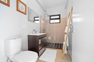 a bathroom with a toilet and a sink at Mimi Holiday House - Free Parking in Funchal +30 photos