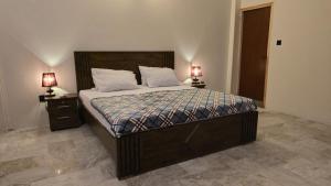 Ένα ή περισσότερα κρεβάτια σε δωμάτιο στο StayOra Guest House