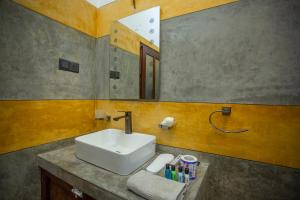 a bathroom with a sink and a mirror at Saku Residence in Unawatuna +64 photos