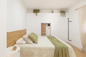 a bedroom with a large bed with white walls at Mirador de la Peña in Arcos de la Frontera +42 photos