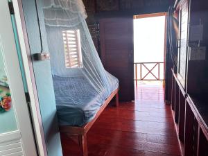 Giường trong phòng chung tại Mama's Bungalows Koh Chang Ranong