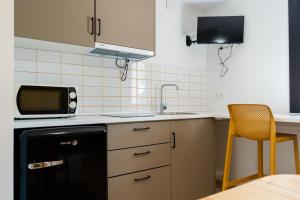 Kuchyň nebo kuchyňský kout v ubytování Camping Cambrils Caban