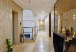 a hallway of a building with a fireplace in it at Hotel O Delhi in Karol Bagh Delhi - A budget Friendly Hotel in New Delhi