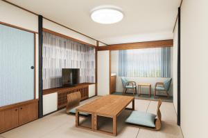 a rendering of a room with a table and chairs at KAMENOI HOTEL Kusatsu Resort in Kusatsu