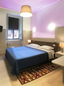 Postel nebo postele na pokoji v ubytování Albergo Annabella