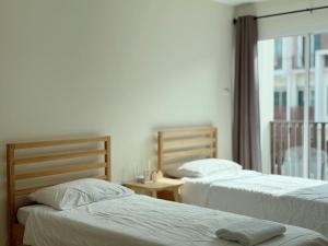 Ένα ή περισσότερα κρεβάτια σε δωμάτιο στο Jira cozy room Suvarnabhumi Airport 15mins +13 φωτογραφίες