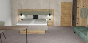 a bedroom with a large bed and a table at die Harmonie in Nauders