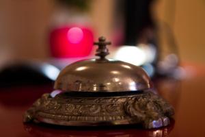 a silver bell sitting on top of a table at Accommodation Zara in Vukovar