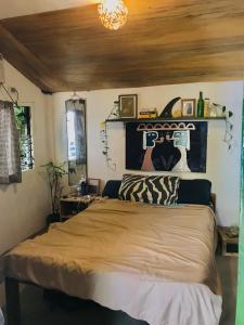 a bedroom with a large bed in a room at The Art House in Villasis