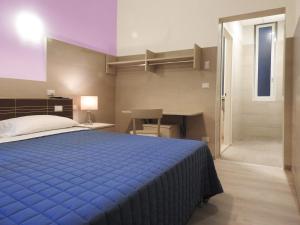 Postel nebo postele na pokoji v ubytování Albergo Annabella