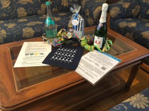 a coffee table with two bottles of wine on it at Ferienhaus Berta in Süderende +13 photos