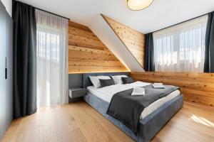 Postel nebo postele na pokoji v ubytování Roubenka Lipno