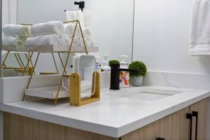 a kitchen counter with a towel rack with towels at Modern Suite by Hospital 2 Near Transit, Wi-Fi, Netflix in Edmonton