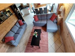 an overhead view of a living room with a couch and a table at Ferienhaus, Wissinghausen in Medebach