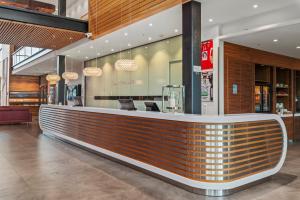 a bar in a shopping mall with a counter at Quality Hotel Ulstein in Ulsteinvik
