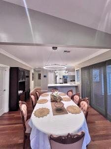 a large dining room with a table and chairs at 'Wallan luxury house in Wallan