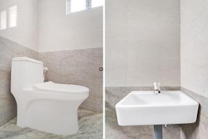 Et badeværelse på Hotel O by OYO RISHI RESIDENCY