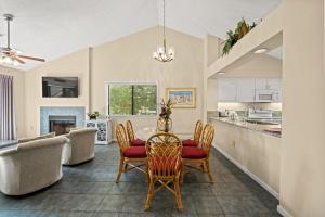 a kitchen and living room with a table and chairs at Kingston Plantation - Richmond Park #7E in Myrtle Beach