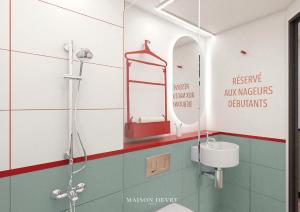 Un baño con ducha, lavabo y espejo. en ibis Styles Colombes Paris Ouest (Ouverture Octobre 2025), en Colombes