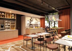 a restaurant with tables and chairs and a kitchen at ibis Styles Colombes Paris Ouest (Ouverture Octobre 2025) in Colombes