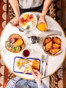 a table full of breakfast foods on a table at ibis Styles Colombes Paris Ouest (Ouverture Octobre 2025) in Colombes +3 photos