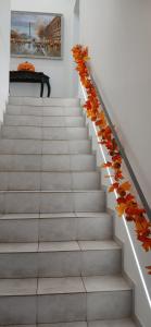 a stairway with a bunch of autumn leaves on it at Cichy Zaułek 8A in Brodnica