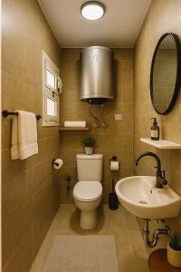 a bathroom with a toilet and a sink at Madinty Stylish Stay in B6 in Madinaty +66 photos