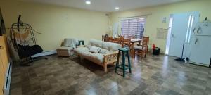 a living room with a couch and a table at Comoda quinta en El Pato in El Pato