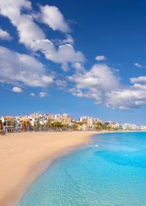 a view of a beach with a city in the background at NIU Line - Be Line Group in Villajoyosa