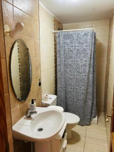 a bathroom with a sink and a shower curtain at Arucas Relax in Arucas