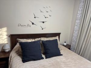 a bedroom with a bed with birds on the wall at Emily Pirin Golf in Razlog +13 photos