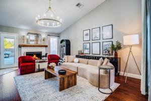 a living room with a couch and a fireplace at The McKinney Luxury Escape Close to Everything! in McKinney