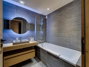 a bathroom with a bath tub and a sink at Appartement spacieux avec balcon - Tignes le Lac - FR-1-641-83 in Tignes +13 photos