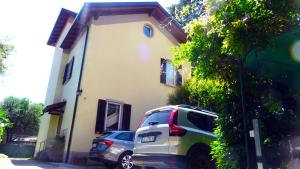 a car parked in front of a house at Adda River Tower Room in Calolziocorte