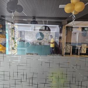 a man standing in front of a wall with a maze at Hotel Indra in Jaipur