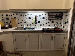 a kitchen with a sink and a counter top at Taco Super Place in Unawatuna