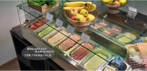a display case in a store with fruits and vegetables at Hotel 24 - Karihaara - Kemi in Kemi