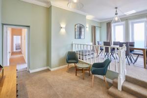 a living room with a table and chairs and a dining room at Host & Stay - Swift View in Whitby +15 photos