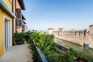 a view of a river from a balcony of a building at Syrmioncello - Castle Lounge in Sirmione