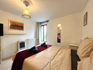 a bedroom with a bed with two teddy bears on it at City Center - Duplex Studio - Close to RER in Saint-Germain-en-Laye +24 photos