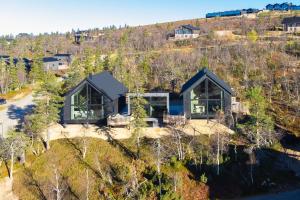 an aerial view of a house on a hill at Aura Arctic Chalets - Grand Panoramic & Grand Hideaway in Saariselka