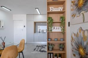 a living room with a table and a dining room at Ocean Breeze in Summerstrand