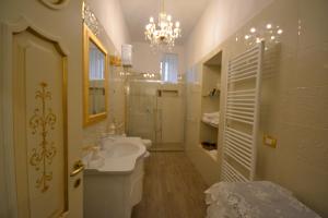 a white bathroom with a sink and a toilet at Neaiton in Noto +65 photos