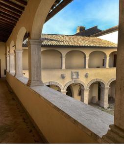 an outside view of a building with arches at La Maison di Sara in Castel Madama