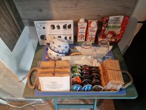 a table with a tray of food and drinks at B&B La Riva del Po Camera indipendente in Turin